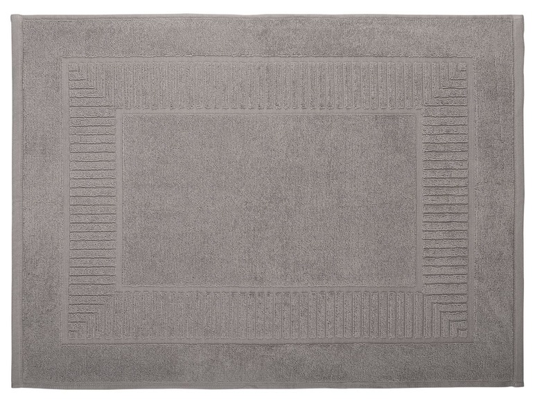 Tapis de bain gris avec un motif.