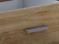 Un tiroir en bois avec une poignée argentée.