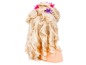 Blonde pruik met krul en vlecht, versierd met roze en paarse haarclips.