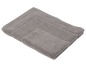 Un tapis de bain en éponge gris.