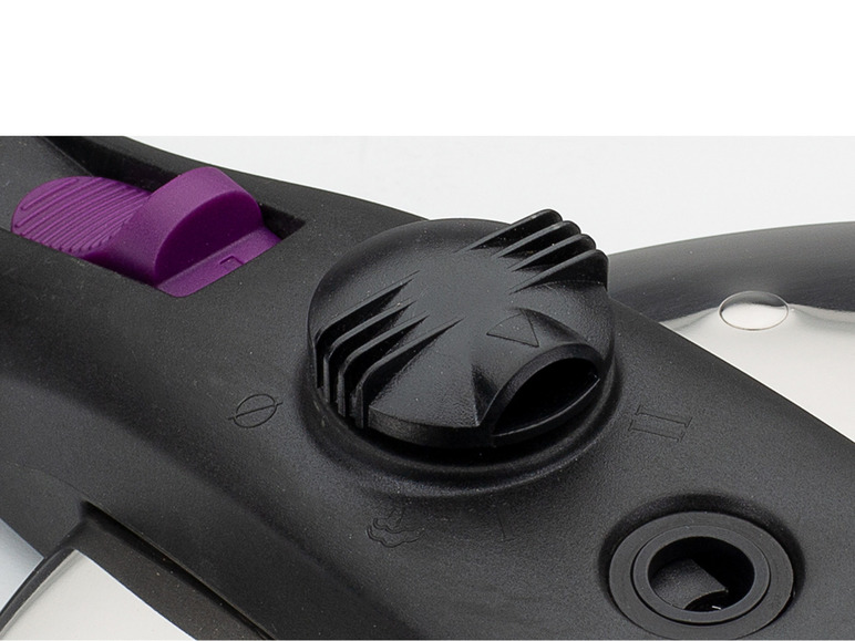 Gros plan sur les boutons d'une cocotte-minute avec un bouton violet.