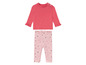 Ensemble bébé fille avec leggings roses à étoiles et t-shirt rose à manches longues.