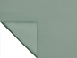 Un tissu vert avec une texture tissée.