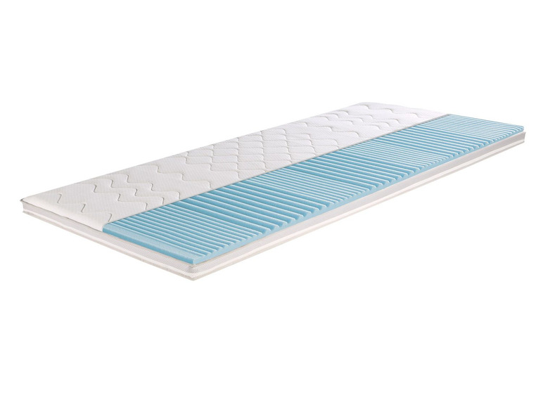 Een wit matras met een blauwe schuimlaag.