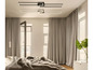 Een moderne slaapkamer met grijze gordijnen, een bed met een bont dekbed en een opvallende rechte hanglamp.
