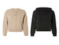 Beige trui met knopen en zwarte hoodie.