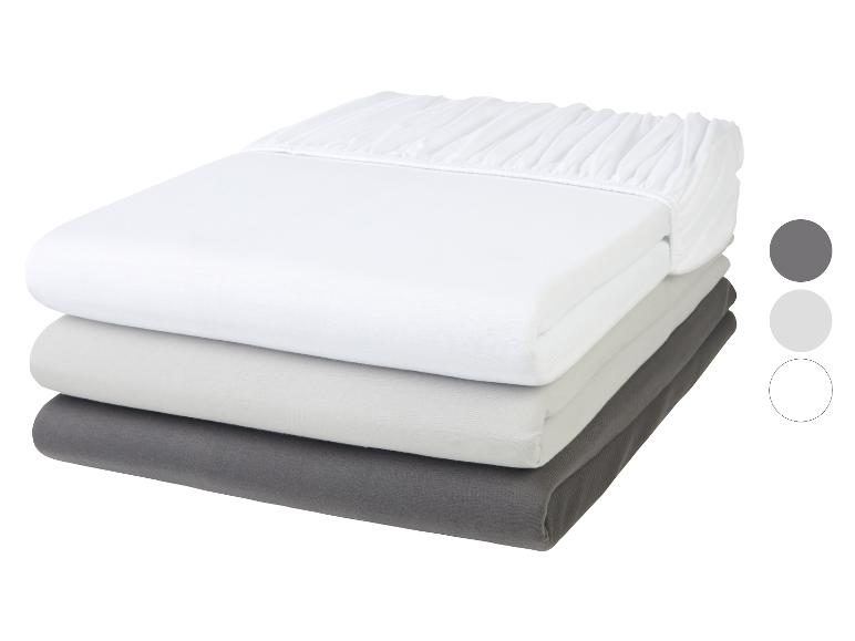 Un drap blanc, gris et gris foncé.