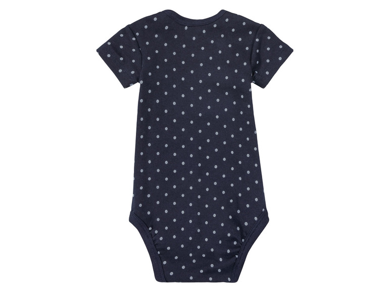 Un body bleu marine à pois blancs.