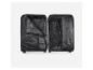 Intérieur ouvert d'une valise noire Esmara avec compartiments en filet et sangles de compression.