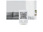 Un radiateur électrique blanc avec une grille et un bouton rotatif.
