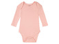 Un body rose à manches longues pour bébé de la marque Lullalove.