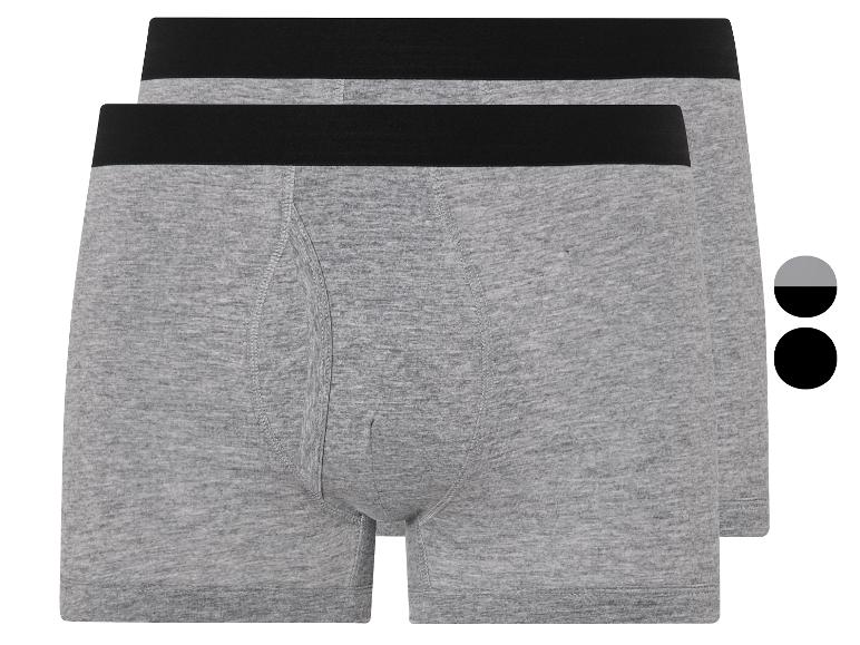 Twee grijze boxershorts met zwarte tailleband.
