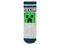 Chaussettes pour enfants avec motif de monstre vert de jeu vidéo.