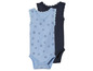 Twee baby rompertjes met een schelp-print en kant.