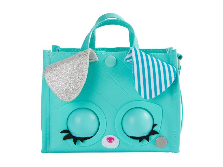 Een turquoise tas met bunny oren en grote ogen.