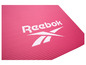 Een roze yoga mat met het Reebok logo.