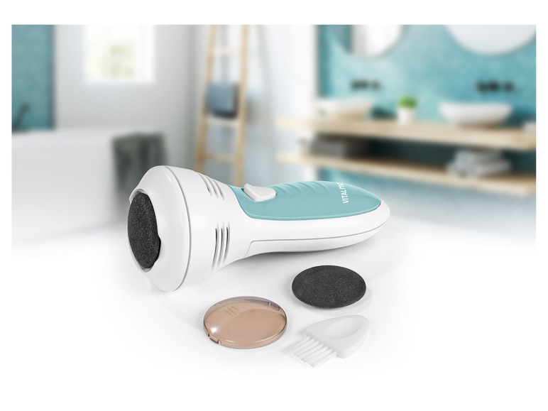 Een Vitalmaxx elektrische voetvijl met extra accessoires.