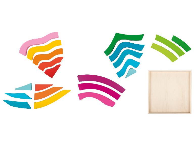 Puzzle en bois avec des couleurs arc-en-ciel et une boîte en bois.