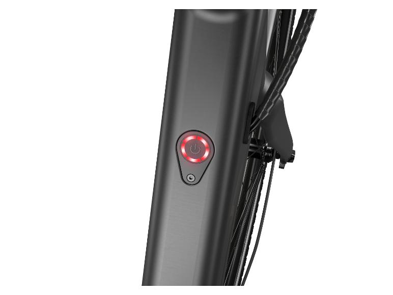 Een close-up van de powerknop van een elektrische fiets.