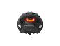 Casque de vélo Crivit noir avec feu arrière LED rouge allumé et réflecteurs.