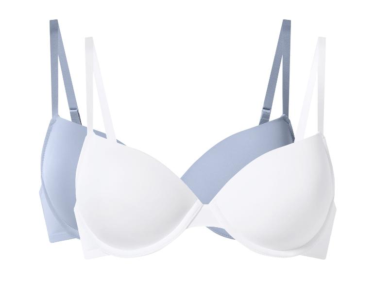 Twee push-up beha's, één wit en één lichtblauw, op een witte achtergrond.