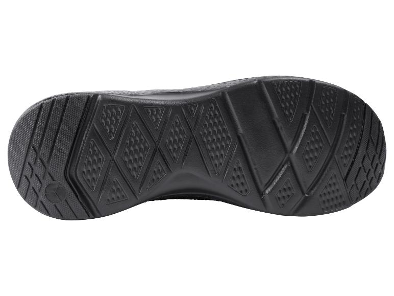 Semelle de chaussure de sport noire avec motif texturé.