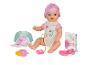 Baby Born pop met accessoires zoals een fles, een speen en een boek.