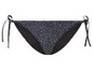 Een zwarte bikini onderbroek met witte stippen.