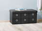 Un banc de rangement noir avec six tiroirs.
