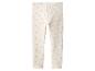Legging blanc pour enfant avec un motif de marguerites roses et oranges.