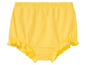 Culotte jaune à volants pour bébé.