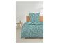 Dekbedovertrek en kussensloop met geometrisch patroon in turquoise en grijs, op een bed met houten hoofdbord.