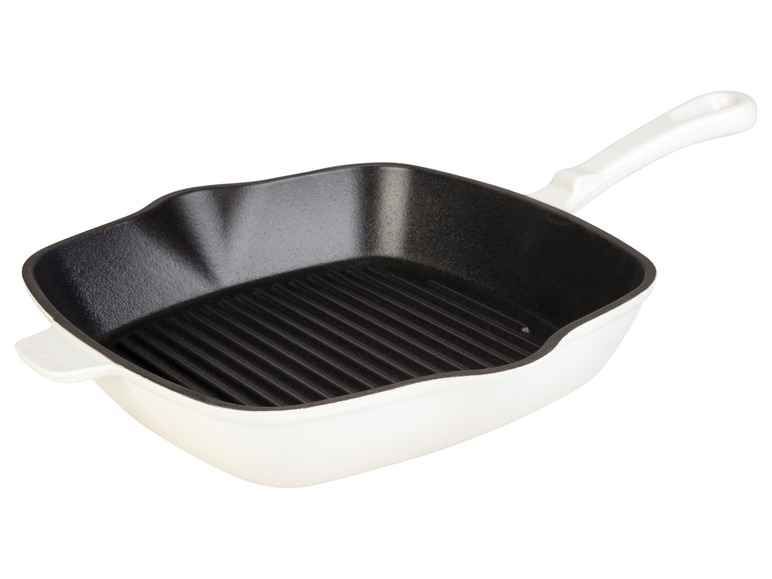 Une poêle à griller en fonte blanche avec un fond strié.