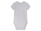 Un body bébé gris à manches courtes.