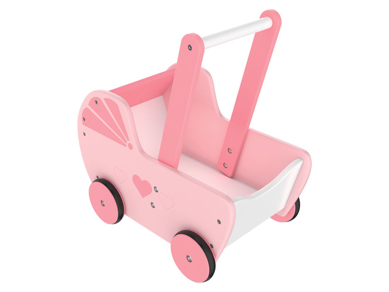 Une poussette en bois rose pour poupées avec des cœurs.