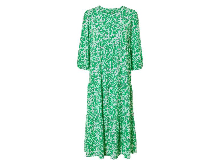 Une longue robe verte avec un motif géométrique blanc.