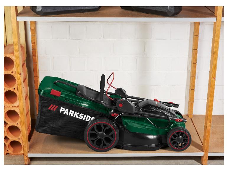 Parkside grasmaaier op een houten plank.