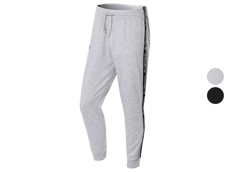 Grijze joggingbroek met zwarte Kappa-strepen.
