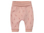 Pantalon bébé rose à imprimé girafe.