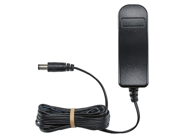 Zwarte stroomadapter met opgerolde kabel en cilindervormige stekker