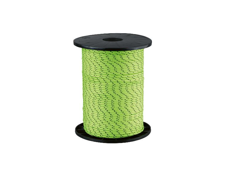 Spoel groen touw met zwarte stippen op een witte achtergrond.
