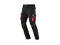 Pantalon de travail noir avec des accents rouges et des éléments réfléchissants.