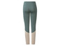 Donkergroene leggings met beige details.