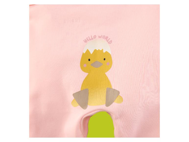 Body bébé rose avec un imprimé de poussin éclos d'un œuf et le texte 'HELLO WORLD'.