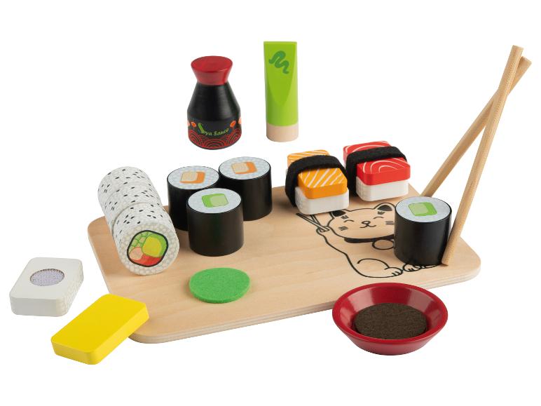 Jouets en bois en forme de sushis, de sauce soja et de baguettes.