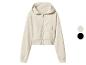Sweat à capuche zippé beige pour femme avec poches et poignets.