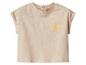 Beige T-shirt met korte mouwen en een gele geborduurde zon op de borst.