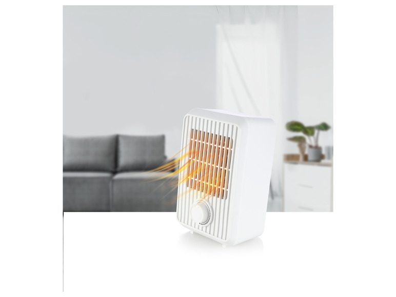 Un radiateur électrique blanc avec une grille qui émet de la chaleur.