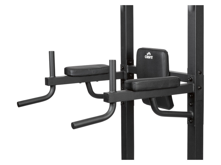 Un rack de musculation Crivit noir avec des barres de dips et une barre de pompes.