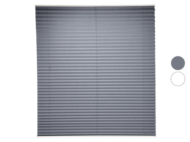 Store plissé gris avec un échantillon de couleur grise et un contour blanc.
